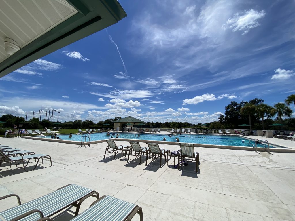 View of the pool with a few lounge chairs.